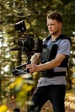 Dylan uses a steadicam devise in the woods